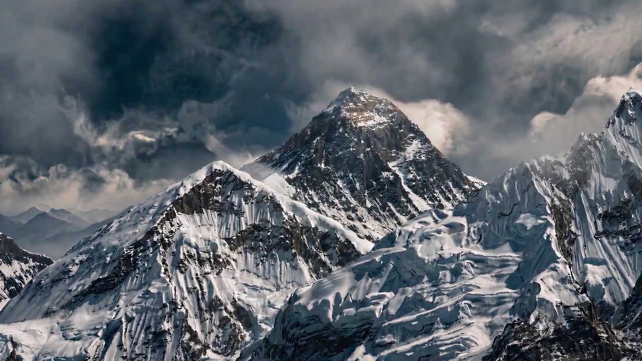 A mountain expedition built around one person within an immense landscape. Close-ups and wide views connect the mountaineer’s experience to the scale of the climb.