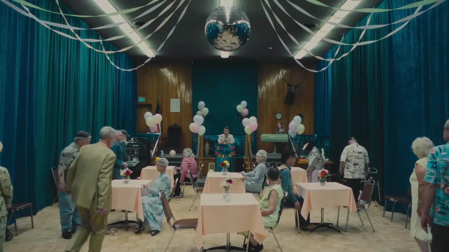 A decorated speed-dating hall from Joji’s Pandemonium announcement film